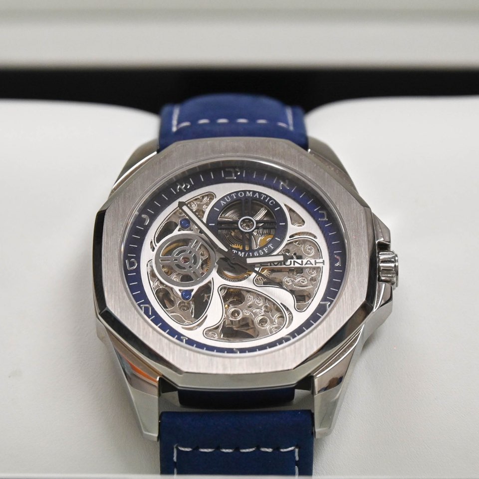 Photo of the Emnunah EC3100 timepiece in an open box (zoomed in)